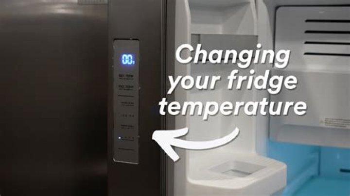 How do I adjust the temperature on my Kenmore Elite refrigerator?